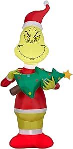 5.5 Ft. Tall Christmas Inflatable Green Christmas Character Dressed in a Santa Hat Holding a Christmas Tree Indoor/Outdoor Holiday Decoration - New for 2022