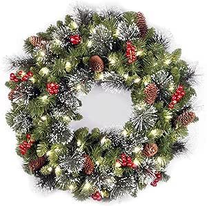 National Tree Company Pre-Lit Artificial Christmas Wreath, Green, Crestwood Spruce, White Lights, Decorated with Pine Cones, Berry Clusters, Frosted Branches, Christmas Collection, 24 Inches